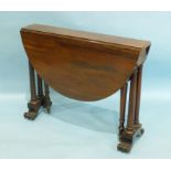A Victorian rosewood drop-leaf Sutherland table with a pair of oval drop leaves, on turned legs