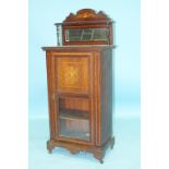 An Edwardian inlaid mahogany music cabinet, 56cm wide, 130cm high and a Victorian octagonal rosewood