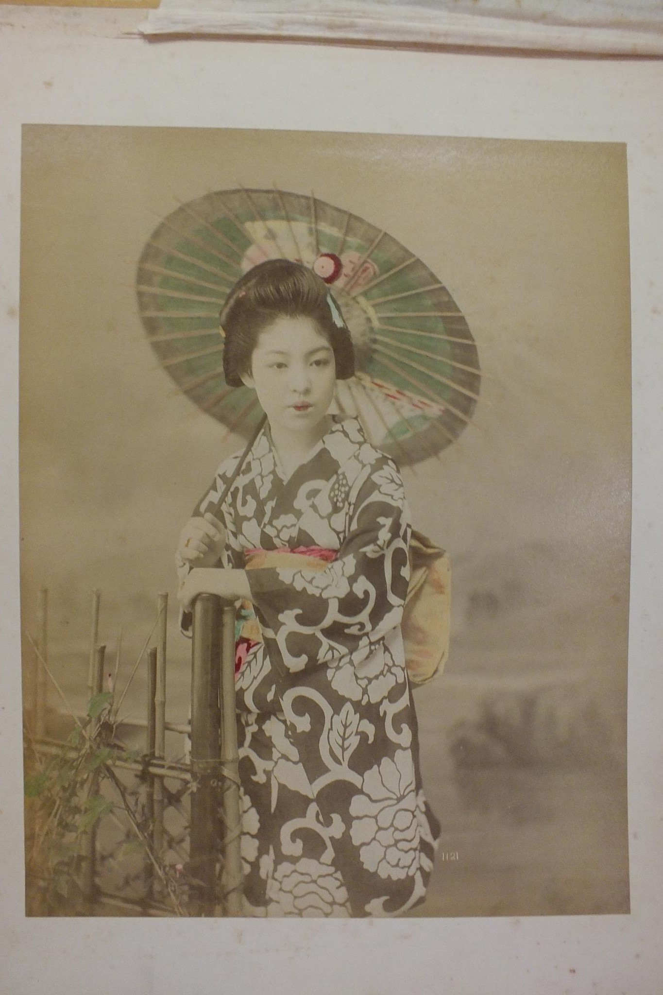 An early-20th century Japanese lacquered shibayama photograph album, containing fifty hand-tinted - Image 6 of 54