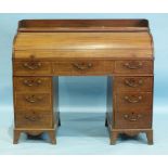 A George III mahogany cross-banded cylinder bureau, the tambour front and fitted interior above
