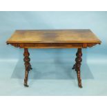 An early-Victorian rosewood centre table, the rectangular top above a frieze drawer, on turned and