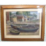 20th century STUDY OF CLINKER-BUILT BOATS ON THE BEACH WITH VILLAGE BEHIND Oil on hardboard,