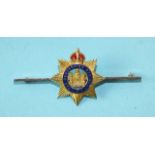 A 9ct gold and enamel Devonshire Regiment sweetheart brooch, 58mm, 5.4g.