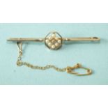 An Edwardian 15ct gold and platinum bar brooch set diamond and seed pearl cluster to centre, 55mm,