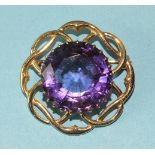 An amethyst brooch claw-set a large round-cut amethyst of approximately 22cts, in 9ct gold mount,