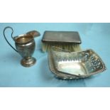 A pierced silver sweetmeat basket, Birmingham 1911, a vase-shaped cream jug, London 1897, etc.