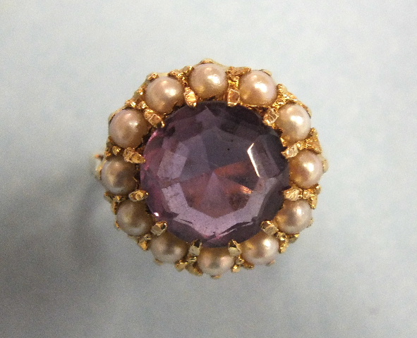 An amethyst and pearl cluster ring in 9ct gold mount, size L½, 5.4g.