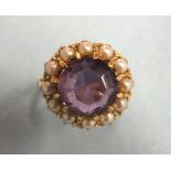 An amethyst and pearl cluster ring in 9ct gold mount, size L½, 5.4g.