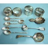 Four napkin rings, a small silver sifter spoon and other small silver, ___5oz.