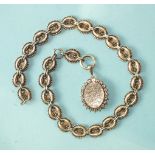 A Victorian silver locket on unmarked oval beaded-link chain, 49.5cm long.
