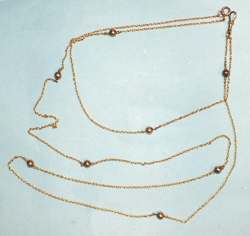 A 9ct yellow gold guard chain interspersed with rose gold ball links, 144cm long, 20.8g.