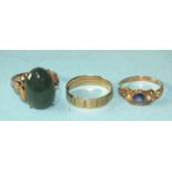 A 14k gold ring set an oval jadeite cabochon, size M½, 4.8g, a 9ct gold wedding band, size L½, 1.