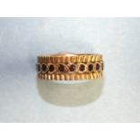 A 9ct gold eternity-style ring set garnets, size P, 4.6g.