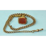 A gold-plated fob seal with cornelian intaglio, on gold-plated watch chain.