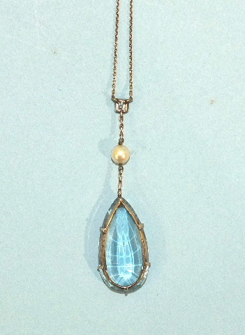 An early-20th century aquamarine, diamond and pearl pendant on chain, the pear-shaped aquamarine - Image 2 of 3