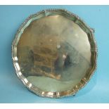 A circular gadrooned salver on claw and ball feet, London 1897, 27cm diameter___18oz.