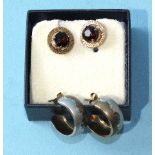 A pair of 9ct gold ear studs set round-cut garnets, 1.7g and a pair of small two-tone hoop earrings,