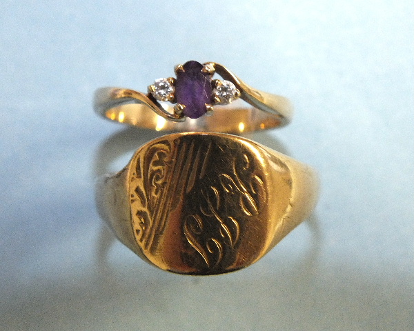 A 9ct gold ring set an amethyst and two white stones, size L and a 9ct gold signet ring, size U, 4.