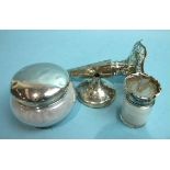 A silver-topped powder bowl, London 1925, (dented), a silver-topped salts bottle and a silver