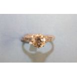 A solitaire diamond ring claw-set a brilliant-cut diamond of approximately 1.3cts, VVS, M-N, in