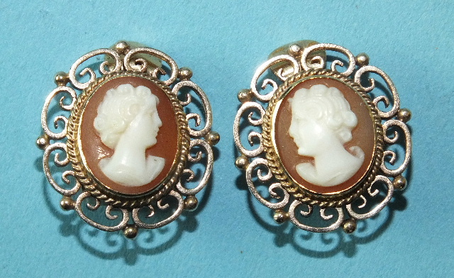 A pair of cameo ear clips, the shell cameos set in 9ct gold scroll mounts, 20 x 18mm, 7.4g.