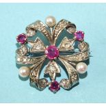 A 9ct white gold trefoil brooch set brilliant and 8/8-cut diamonds, round-cut rubies and cultured