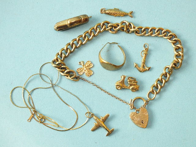 A 9ct gold curb-link bracelet with padlock clasp, six 9ct gold charms, (detached), a 9ct gold fine