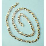 A 14ct gold necklace of alternate white and yellow gold links, 61cm long, 40g.