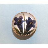 An Essex crystal brooch, gentian violets, with mother-of-pearl back and gold mount, 22mm diameter,