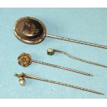 An early-20th century fox head stick pin, a small 15ct gold stick pin set ruby and pearl and two