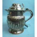 A George III half-gadrooned lidded jug with S-scroll handle, later-engraved beneath In Memorium N