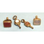 Two 19th century seals, one set cornelian, the other chalcedony and two hardstone-set watch keys, (