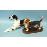 A Lomonosov porcelain model of a recumbent pointer, 30cm long, 16cm high, together with a Beswick