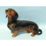 A Beswick black and tan dachshund, 26.5cm high and a SylvaC otter no.3459, 18cm high, (2).