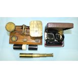 A set of brass postal scales and weights on rectangular wooden stand, a small brass three-draw