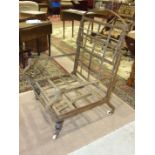 A late 19th century metal frame and strap folding lounger chair with turned wood front legs.