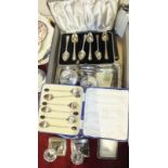 A pair of loaded silver short candlesticks, six silver handled cutter knives, cased and other plated