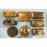 A wooden puzzle snuff box and seven other wooden snuff boxes.