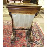 A Victorian mahogany work table, the rectangular hinged lid, (warped) and fitted interior above a