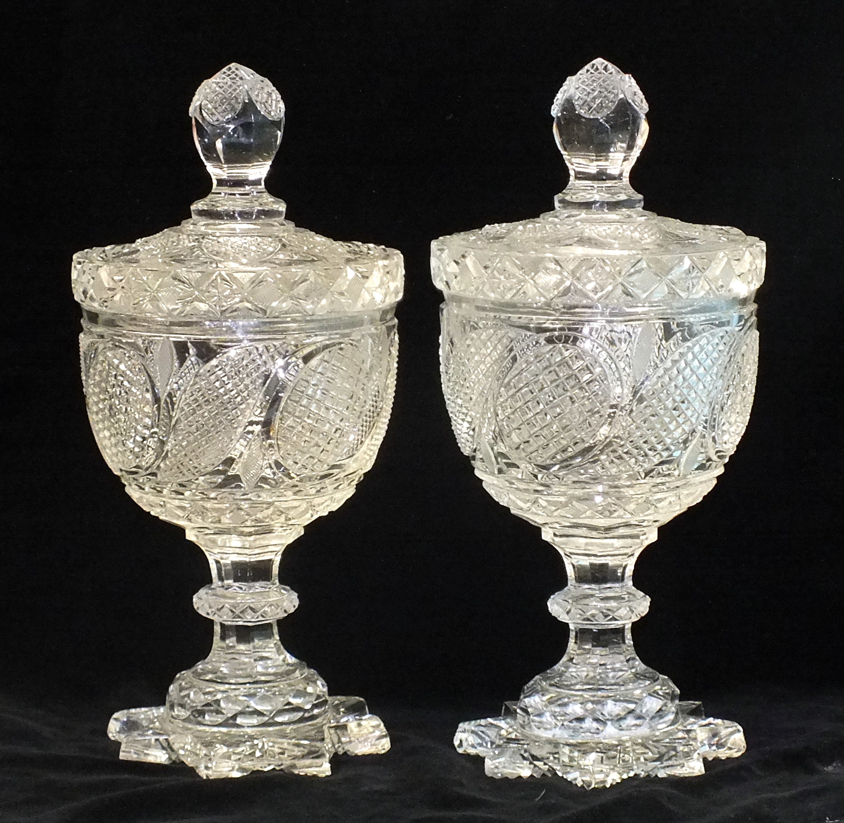 A pair of late-19th century cut-glass sugar vases with lids, 30cm high.