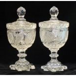 A pair of late-19th century cut-glass sugar vases with lids, 30cm high.