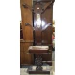 A Victorian mahogany hat and coat stand, having four branches above a glove box and stick stand,