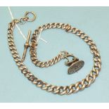 A silver graduated curb-link half-Albert watch chain with white metal fob seal, 62g.