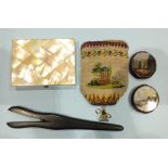 A mother-of-pearl card case, 10.5 x 7.5cm, two circular pin cushions with mirrors, decorated with