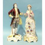 A pair of late-19th century French porcelain figures of a young woman holding a fan, the gentleman