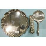 An engine turned silver backed hand mirror, Birmingham 1913, a silver backed hair brush and a plated