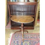 A mahogany finish open bookcase, 105cm wide, 115cm high and an oak circular tilt-top table on tripod
