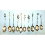 A collection of ten .800 Continental silver stamped souvenir-style spoons, ___4oz, approximately.