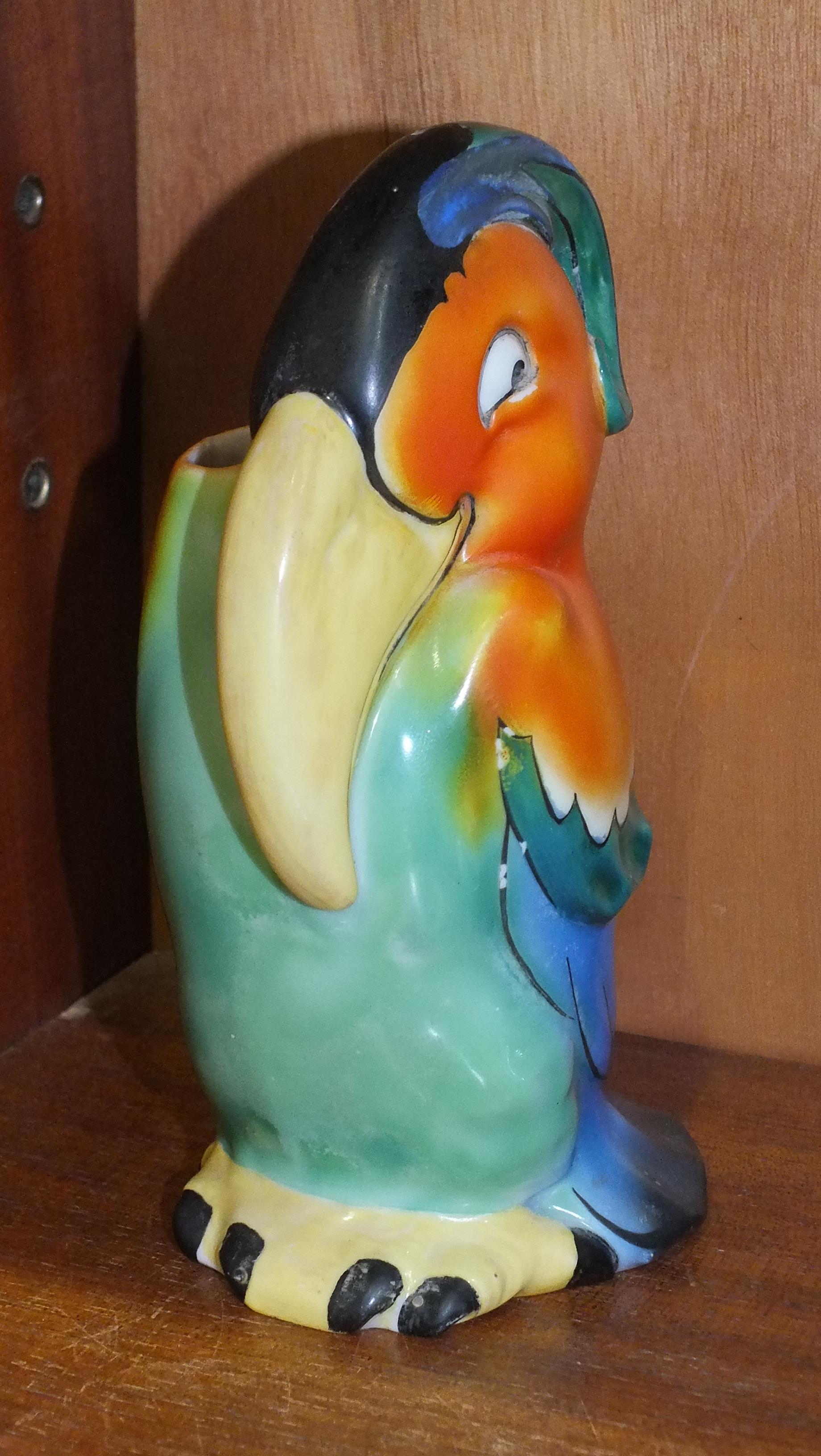 A 1920's-30's Goebel spill vase in the form of a brightly-coloured stylised toucan, 17.5cm high,