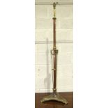 A copper and brass adjustable lamp standard, 200cm high, (extended) and a small embossed brass-